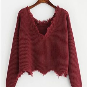 Distressed off shoulder sweater